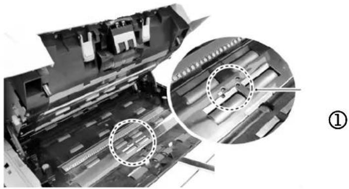 Close-up of a mechanical device with internal components and highlighted circular regions (no visible text or symbols)