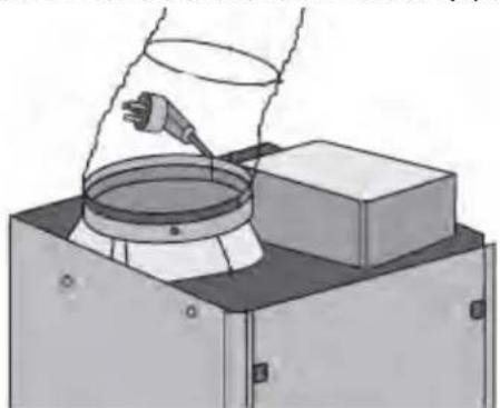 Illustration of a hand pouring liquid into a container with a tool, mounted on a base (no text or symbols visible)