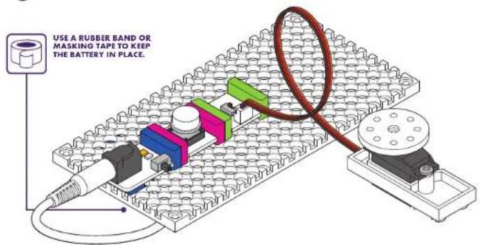 USE A RUBBER BAND OR MASKING TAPE TO KEEP THE BATTERY IN PLACE.