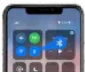 Smartphone screen displaying a control interface with buttons and a blue cursor pointing to a starburst icon, likely for app or settings.