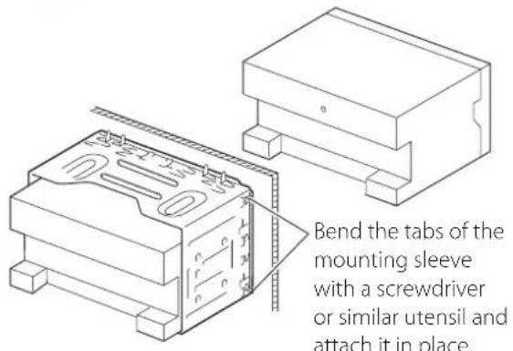 Bend the tabs of the mounting sleeve with a screwdriver or similar utensil and attach it in place.