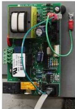 Close-up of an electronic circuit board with visible components and wiring (no readable text or symbols)