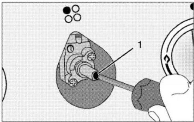 Technical diagram showing a mechanical assembly with labeled component '1' and circular components, likely illustrating a tool or procedure.