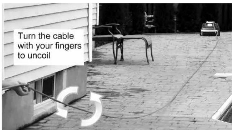 Turn the cable with your fingers to uncoil