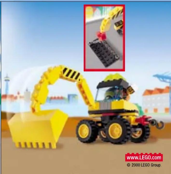 Yellow LEGO excavator with a red handle, displayed outdoors under a blue sky (no text or symbols on the main subject)