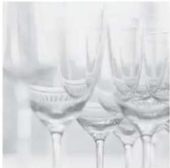 Close-up of several glasses with clear liquid, no visible text or symbols