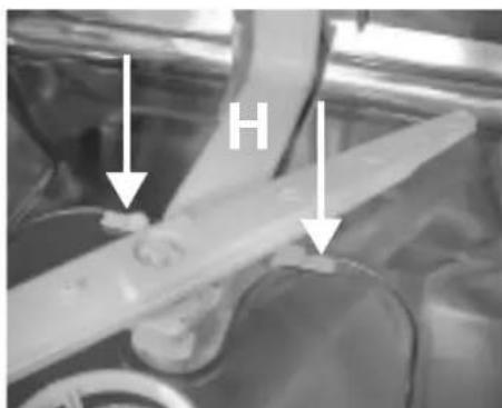 Close-up of mechanical components with arrows pointing to features (no visible text or symbols)