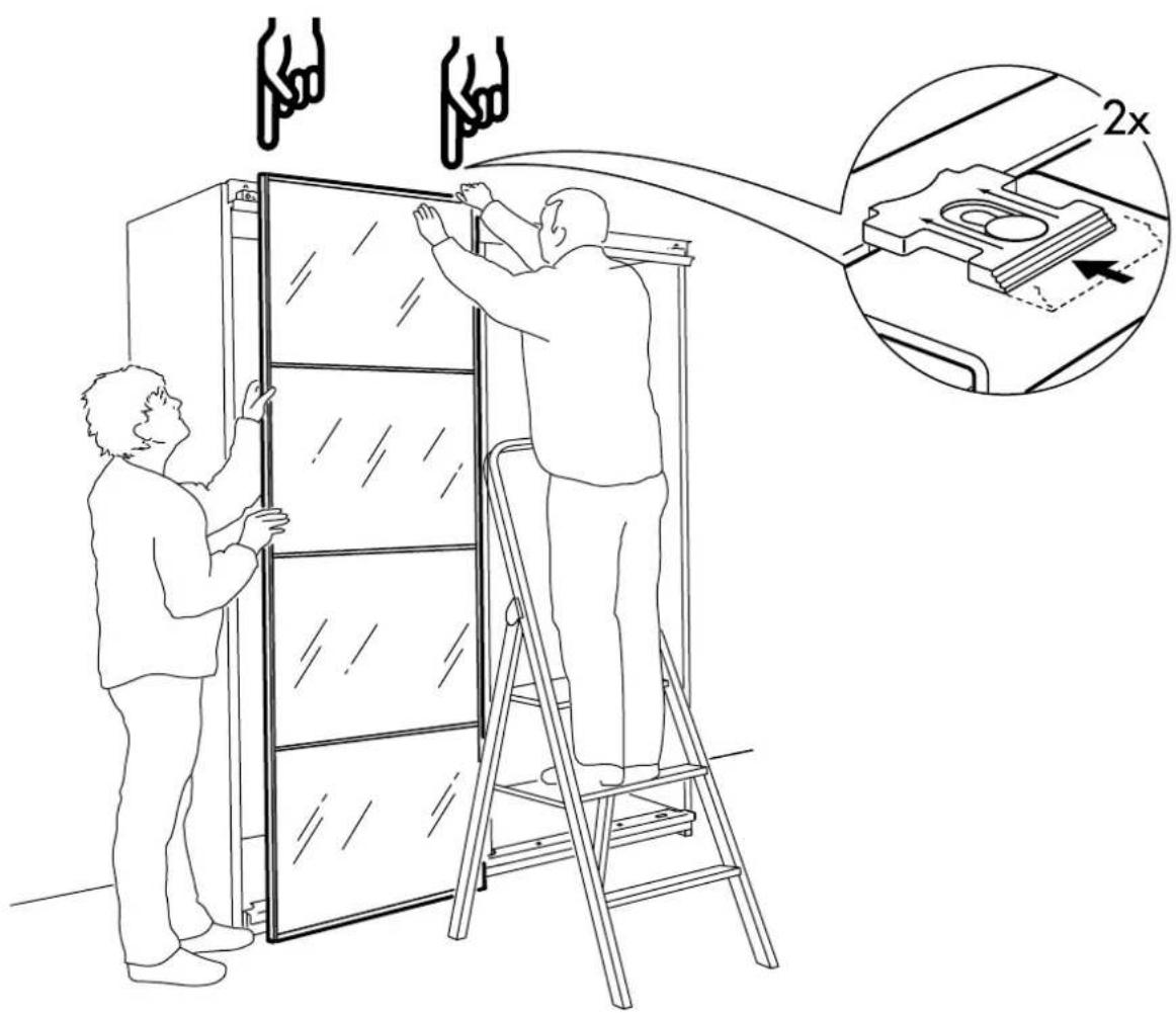 Diagram illustrating two workers installing a door frame with 2x magnified detail showing the device's internal structure.