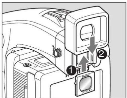 Diagram of a camera module with labeled parts and directional arrows indicating assembly or movement