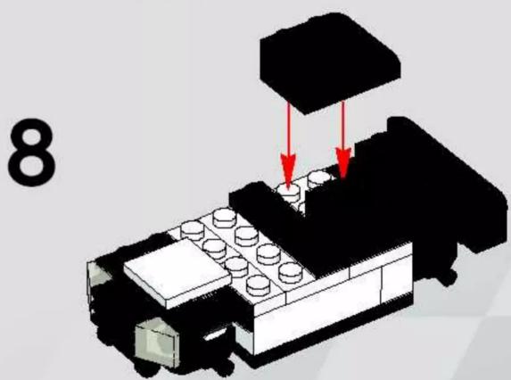 3D diagram of a LEGO building with red arrows indicating assembly or movement, no text or symbols present