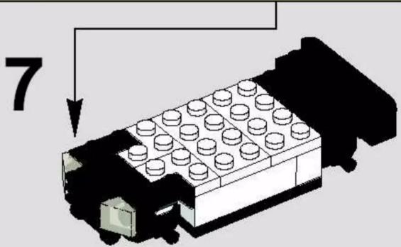 3D diagram of a LEGO car with a numbered arrow pointing to the front panel (no text or symbols on the car itself)