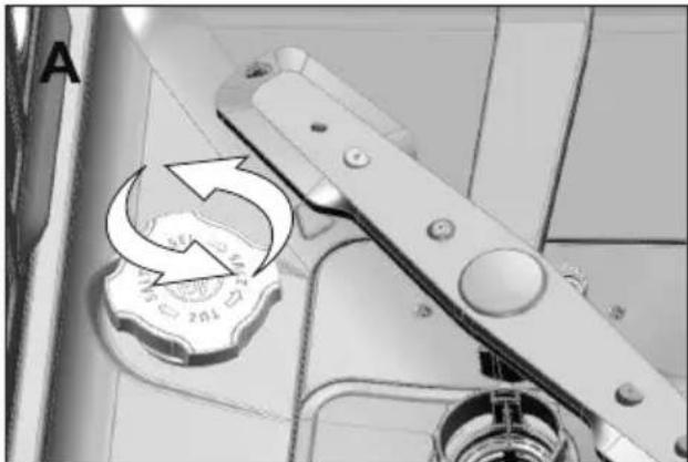 Close-up van een mechanisch apparaat met een draaiknop en richtingspijl (geen zichtbare tekst of symbolen)