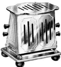 Metallic toaster with vent slots and wheels (no text or symbols visible)