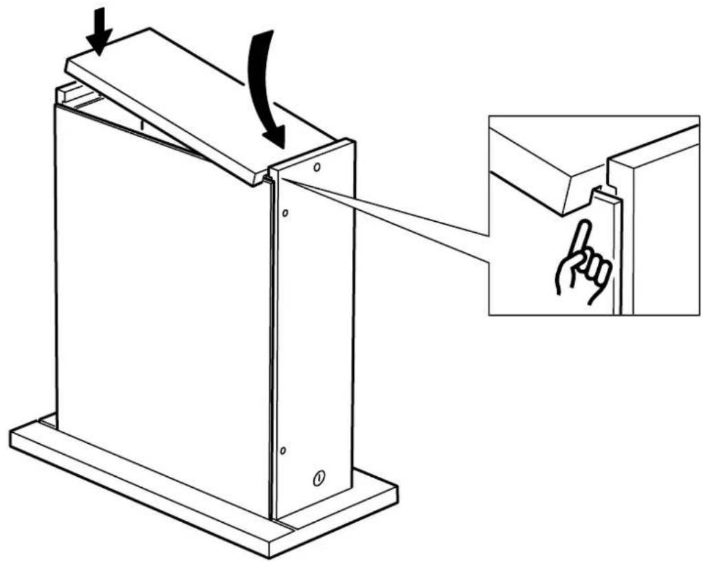 Technical diagram showing a mechanical device with an arrow indicating rotation and a magnified inset showing hand gesture.