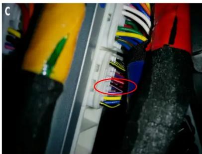 Close-up of electrical connectors with multicolored wires and black insulation (no visible text or symbols)
