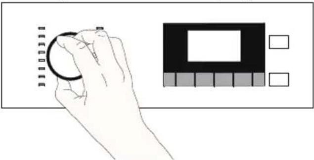 Hand holding a circular object with measurement markings, next to a small diagram showing a rectangle and grid pattern (no text or symbols)