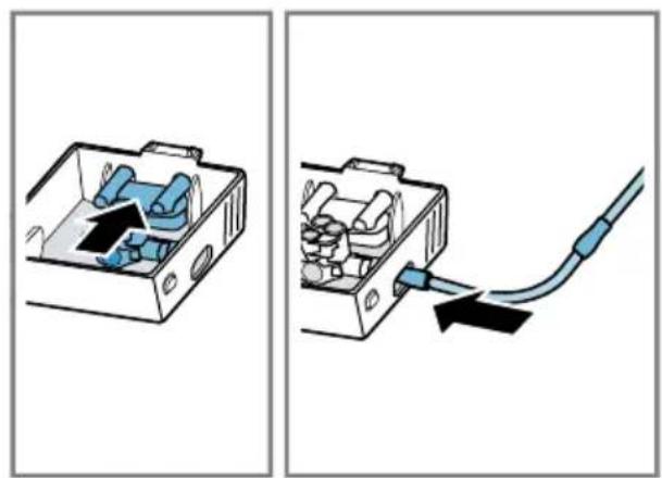 Two-step diagram showing a device inside a box and connected to a cable with an arrow indicating the cable attachment (no text or symbols present)