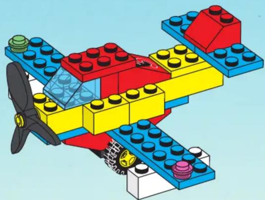 3D illustration of a LEGO airplane with red, yellow, and blue components and propeller (no text or symbols)