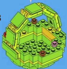 3D architectural model of a green building with multiple circular components and structural beams (no text or symbols visible)