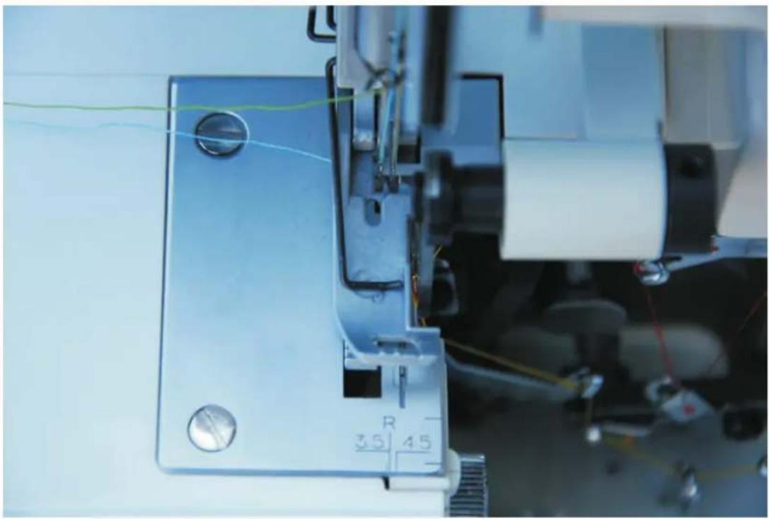 Łucznik Overlock 720D4 - Regulacja szerokości ściegu - 3