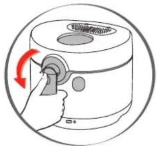 Diagram showing a hand operating a kitchen appliance with red rotation arrow indicating clockwise motion