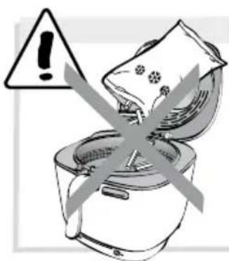 Warning symbol with exclamation mark over a kitchen appliance, indicating hazardous or unexposed food items.