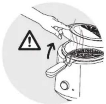 Warning symbol and instruction illustration showing hand removing a grating into a kitchen appliance with warning arrow