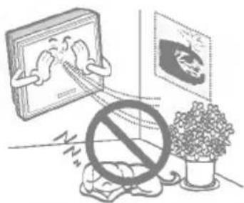 Illustration showing a person reacting to a photo of a framed picture, with a prohibition symbol and a potted plant nearby.