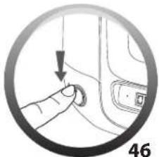 Close-up of a finger pressing a button on a car interior, with no visible text or symbols
