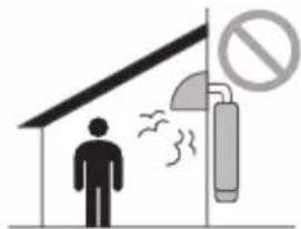 Safety warning illustration showing a person standing near a building with smoke and a no-smoking symbol