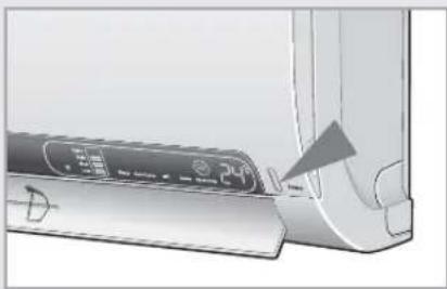 Close-up of a device with a 24V indicator and a triangular warning symbol, no visible text or symbols on the device itself.