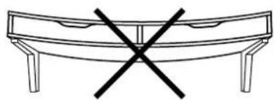 Simple line drawing of a curved table with four legs and a black X symbol (no text or labels)