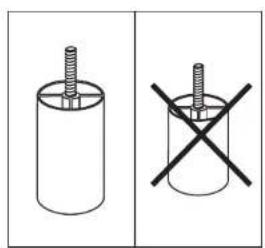 Two diagrams showing a cylindrical object with a screw and a cross symbol, no text or labels present.