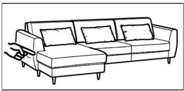 Line drawing of a single sofa with four cushions and a hand holding the seat (no text or symbols)