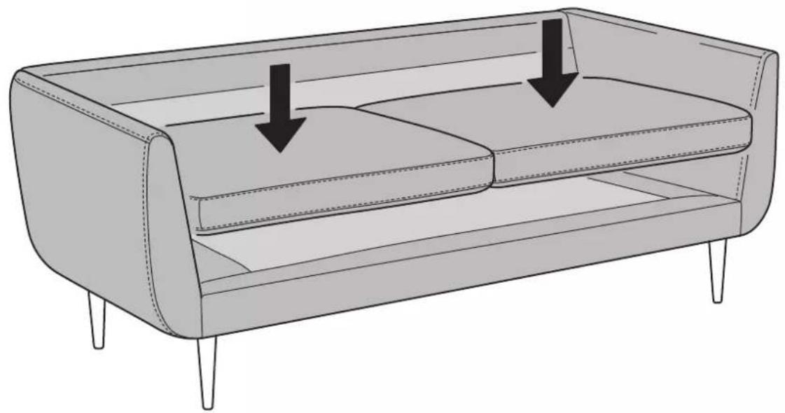 Line drawing of a two-seater sofa with legs and backrest, showing internal seating arrangement and two downward arrows indicating movement (no text or symbols)