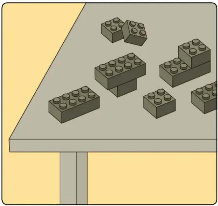 Illustration of various LEGO blocks arranged on a table, no text or symbols present