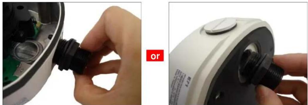 Close-up of hands installing a black plastic component into a white electronic device, with no visible text or symbols.