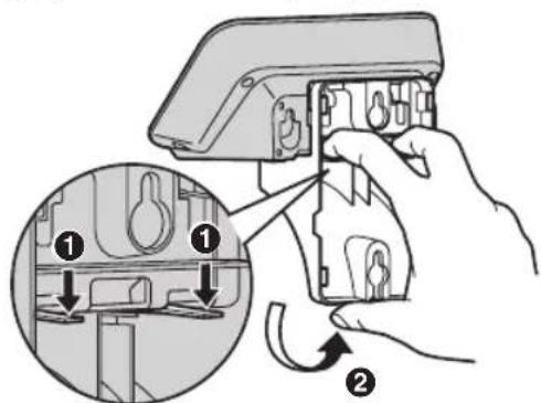 Diagram illustrating a hand holding an electrical switch with labeled parts and directional arrows indicating assembly or repair steps.