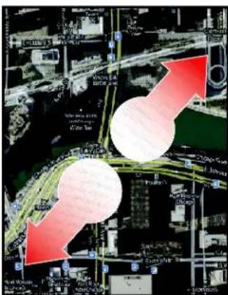 Satellite map image with overlaid red arrows indicating directional changes or flow, showing urban road networks and green routes.