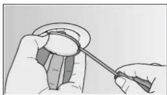 Illustration of a hand holding a small object with a tool, no text or symbols present