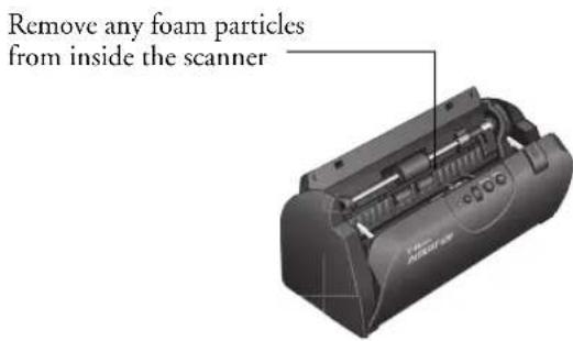 Remove any foam particles from inside the scanner