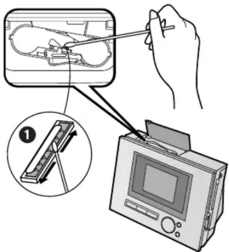 Diagram illustrating a handheld device operation with labeled parts and a magnified view of the component being processed.