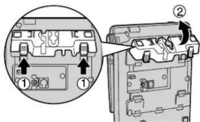 Technical diagram showing a device interior with labeled parts and directional arrows indicating assembly or movement.