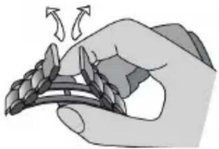 Illustration of a hand holding a bundle of grains with arrows indicating rotation (no text or symbols).
