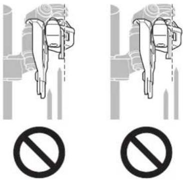 Diagram showing two identical mechanical components with a prohibition symbol below, indicating no protection or disapproval.