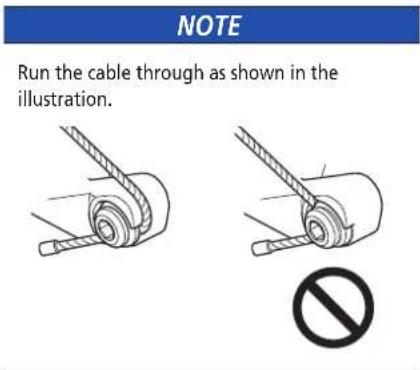 NOTE Run the cable through as shown in the illustration.