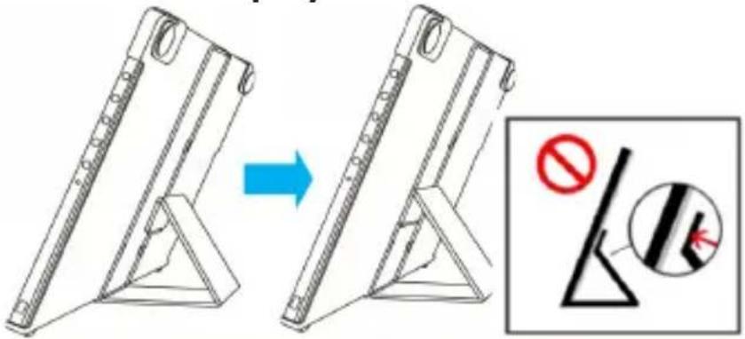 Diagram showing a device being lifted by a blue arrow, with a warning symbol and a magnified view of the device.