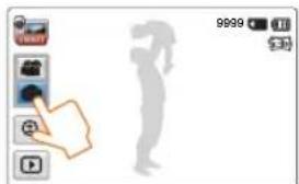 Mobile app interface screenshot showing camera control buttons and a silhouette of a person pointing to the camera.