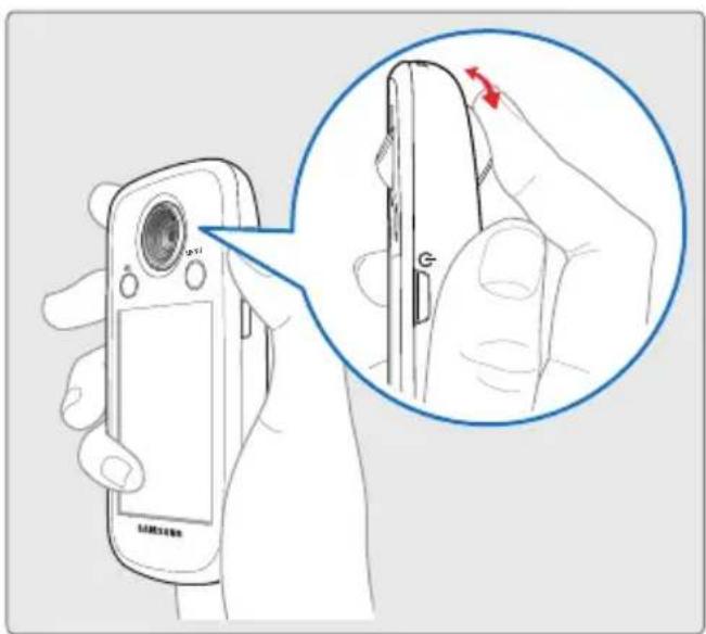 Diagram showing a hand holding a Samsung flip phone with a magnified view of the screen highlighting a red arrow indicating rotation.