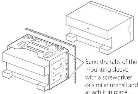 Bend the tabs of the mounting sleeve with a screwdriver or similar utensil and attach it in place.